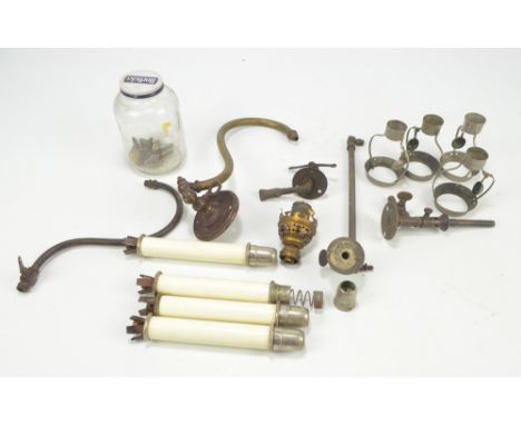 A quantity of glass funnels for oil lamps, also a small quantity of further oil lamp fittings and two shades, one opaque.