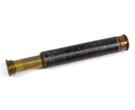 JL COPPOCK LTD OF LONDON; a 0.75" brass three-draw telescope with stitched leather barrel, length 17cm.