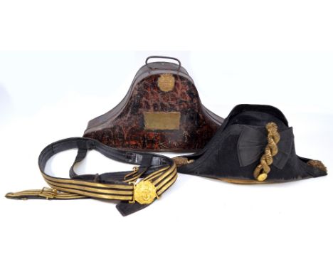 A cased Gieve Royal Navy bicorn hat with gilt anchor button and bullion work coils, maker's stamp to interior silk lining, in