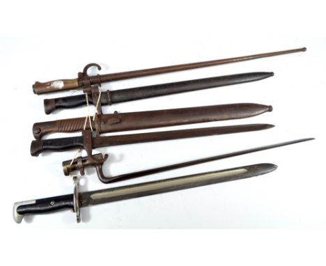 Six various bayonets including a socket bayonet, two further in scabbards, a spike bayonet in scabbard, etc, with various mar