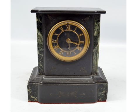 A late 19th century French black slate and green marble detailed mantel clock with circular dial set with Roman numerals, hei