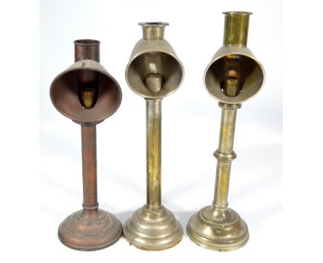 A Cambridge reading lamp, no.2, and two similar examples, height 40cm, 38cm and 35.5cm (3).