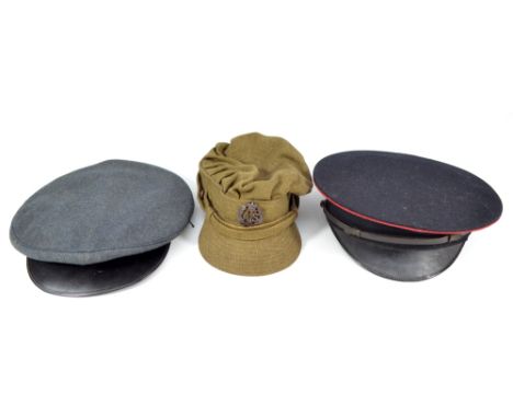 Three mid-20th century cloth peaked caps to include khaki example with auxiliary territorial service badge and internal stamp