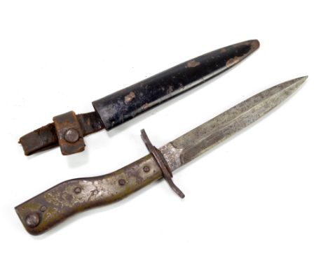 An Imperial German fighting knife/bayonet, the blade stamped to one side 'Demag Duisburg' and 'Gesetzlich Geschultzt' to the 