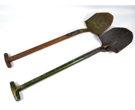Two mid-20th century bladed spades to include a military issue example, the upper haft stamped with broad arrow mark and furt
