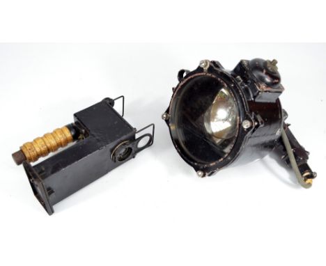 A large unboxed signalling lantern, inscribed 'Patt. W898, Lantern, 6-inch, Serial Number RX45' and a smaller wooden handled 