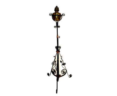 A Victorian black painted iron standard lamp with foliate and scroll detail, height approx 145cm.