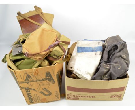 A quantity of WWII and later military canvas bags of varied shapes and sizes, some with internal broad arrow stamps, also an 