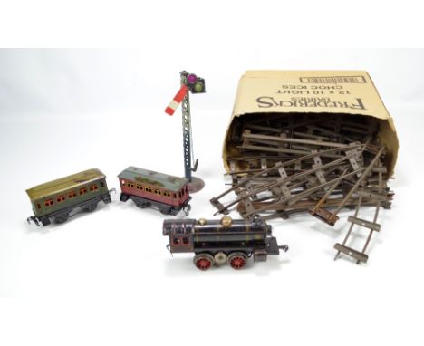A Kraus Fandor tinplate O gauge loco, with light bulb to front, painted in black with red and yellow detail and manufacturer 