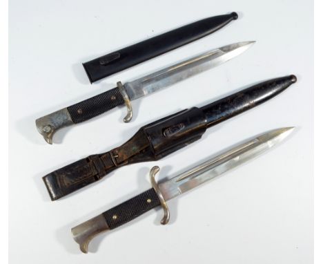 A WWII period German fireman's dress dagger with checkered grip, unnamed blade, metal scabbard and leather frog, and a German