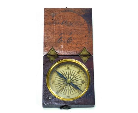 A mid-19th century mahogany cased travel/pocket compass, the blued steel needle with engraved 'N' and 'S', glazed dial diamet