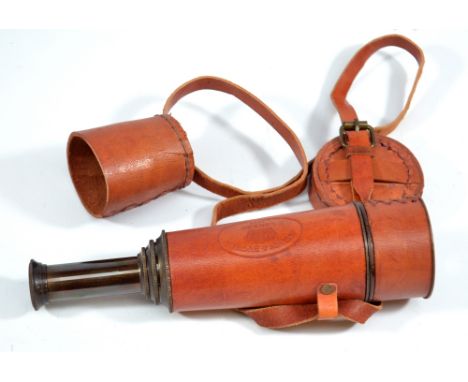 KELVIN & HUGHES OF LONDON; a 1" lacquered brass three-draw telescope stamped London 1917 and in stitched leather case, length