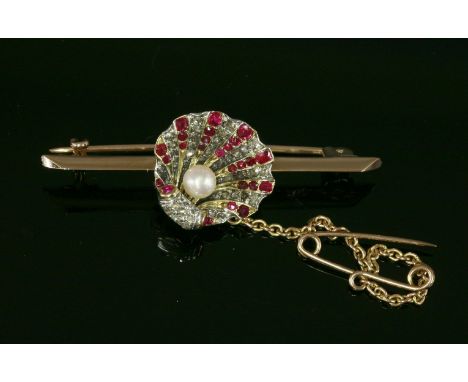 A late Victorian ruby, diamond and cultured pearl brooch,composed of a relief modelled clam shell with radiating rows of old 