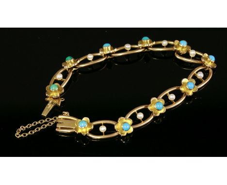 An Edwardian turquoise and split pearl gold chain bracelet, c.1900,composed of open oval links, each one cup and peg set with