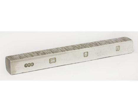 A silver bar paperweight,by Gerald Benney, London 1964,decorated with texturing on two sides, engraved with initials JMT,13.5