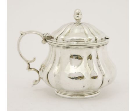 A William IV silver mustard pot,by Joseph Angel and John Angel, London 1832,of fluted baluster form on moulded circular foot 