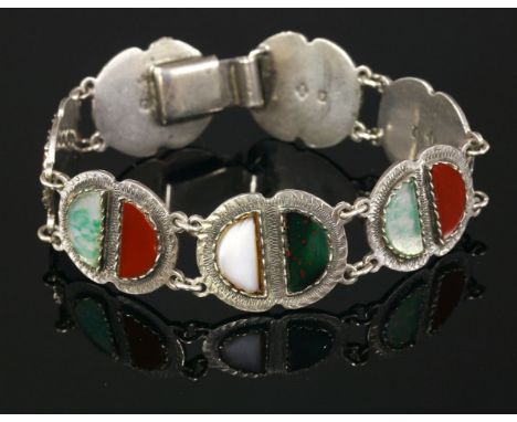 A Scottish sterling silver bracelet, c.1950,by Ward Brothers, with pairs of lunette plaques, each set with glass panels, imit