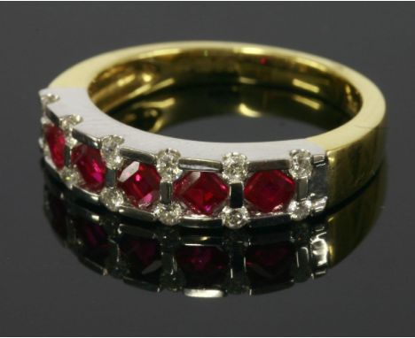 An 18ct yellow and white gold ruby and diamond half eternity ring,with a row of calibre cut rubies, offset to white collets w