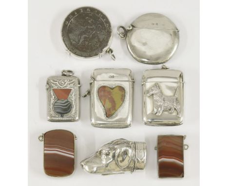 A collection of silver vesta cases,comprising:a mounted George III ‘cartwheel’ Penny, and a plain circular example,Birmingham