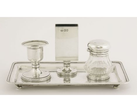 An Edwardian silver inkstand,by Louis Willmott, London 1906,of oblong form on four ball feet, the central upright match strik