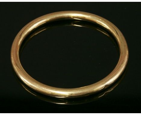 An Art Deco hollow gold slave bangle,marked 15, by Cornelius Desormeaux Sanders and James Francis Hollings Shepherd, 15.2g ap
