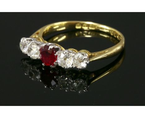 An 18ct gold ruby and diamond graduated five stone ring,with a central circular mixed cut ruby.  Two pairs of old European cu