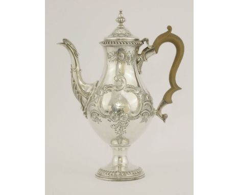 A George III silver coffee pot,by Emick Romer, London 1776,of baluster form on pedestal circular foot with gadroon borders, t