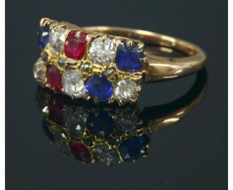 A ruby, diamond and sapphire two row ring, c.1900,with two graduated rows of old European cut diamonds, Swiss cut rubies and 