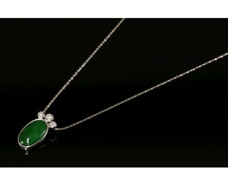 An 18ct white gold jade and diamond pendant,with an oval cabochon jade rub set to a plain collet with three graduated brillia