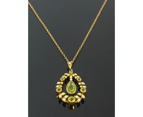 An Edwardian peridot and split pearl gold pendant, c.1910,a pear cut peridot, milligrain set to a plain collet, articulated a