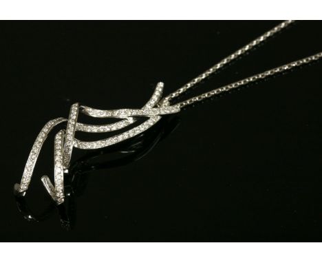 An Italian white gold diamond set pendant,with three curled ribbon strands, claw set with lines of brilliant cut diamonds to 