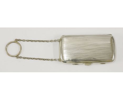 A silver compact, by H Woodward & Co Ltd, Birmingham 1916,of oblong form with linear engraving, the gilt interior fitted with