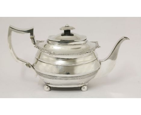 A George III silver teapot,possibly by Thomas Wallis and Jonathan Hayne, London 1815,of bellied oblong form on four ball feet