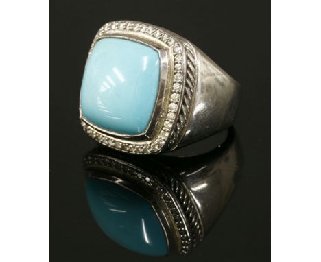 A sterling silver turquoise and diamond Albion ring,by David Yurman, with a cushion shaped turquoise cabochon rub set to a pl