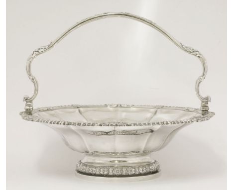 A George IV silver basket,by Paul Storr, London 1827,of lobed shaped circular form with shell leaf and gadroon border on spre