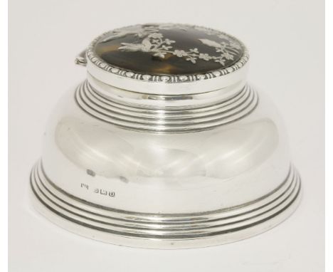 A silver capstan inkwell with tortoiseshell cover,by William Devenport, Birmingham 1928,the cover inlaid with birds and flora