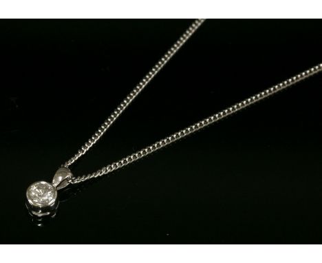 An 18ct white gold single stone diamond pendant,with a brilliant cut diamond with a stated weight of 0.40ct, rub set to a pla