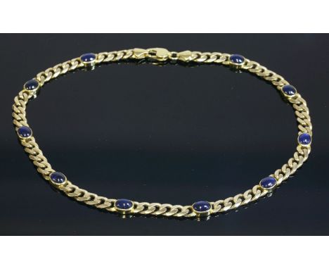 A Continental gold and sapphire set curb chain necklace,with ten oval cabochon sapphires, each one rub set in a plain collet,