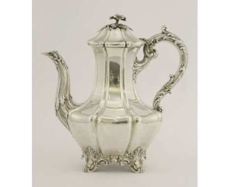 A Victorian silver coffee pot,by Edward & John Barnard, London 1851,of melon shape with waisted neck on four leafy scroll bra