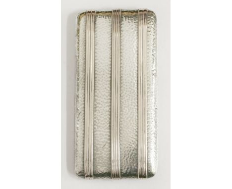 An Edwardian silver cigarette case,by Goldsmiths' & Silversmiths' Company Ltd., London 1903,of spot hammered rectangular form