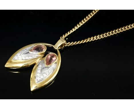 A pink topaz and diamond gold pendant,with two pear shaped pink topaz, each one rub set to a plain yellow gold collet.  White