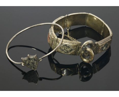 A Scottish silver hardstone bracelet,with a series of arched rectangular plaques, each one set with a marquise shaped granite