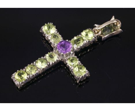 A late Victorian amethyst, peridot and diamond set Latin cross,a circular mixed cut amethyst, claw set to the centre, with li