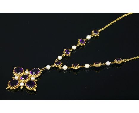 A 9ct gold, amethyst and cultured pearl necklace,by Deakin and Francis, Birmingham 1976.  A centrepiece composed of alternate