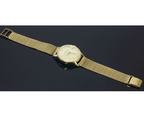 A gentlemen's 9ct gold Eterna-Matic watch,on a later 9ct gold Milanese bracelet.  Circular silvered dial with raised gilt bat