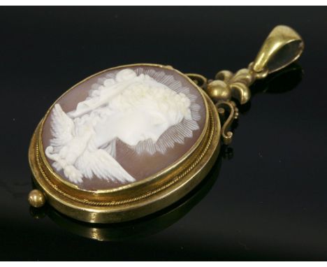 A Victorian gold carved shell cameo pendant,depicting Eos, the goddess of the dawn.  The bust carved in white to a light brow