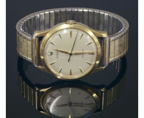 A gentlemen's 9ct gold Rolex Precision mechanical strap watch,on a later expanding bracelet.  Circular silvered dial with gil