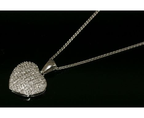 A 9ct white gold diamond set heart pendant,with brilliant cut diamonds grain set to a lightly domed heart, a polished 'V' sha