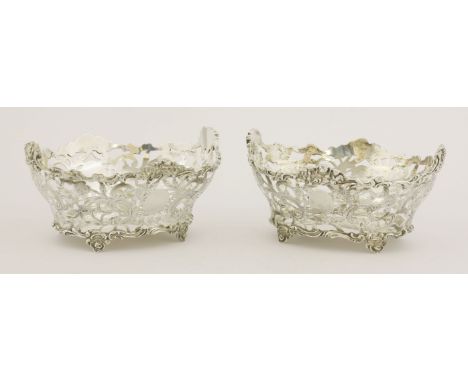 A pair of small Victorian silver baskets,by Charles Stuart Harris, London 1899,of foliate scroll engraved and pierced oval fo