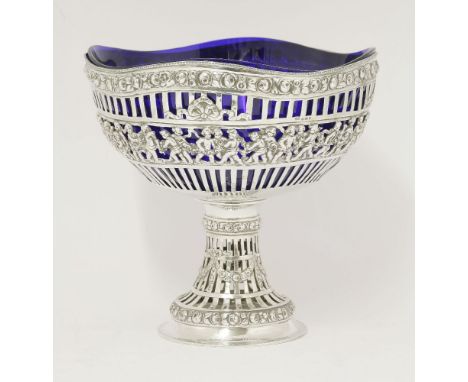 A silver bowl,import hallmarked London 1929,of strapwork pierced circular form decorated with central panel of putti and addi